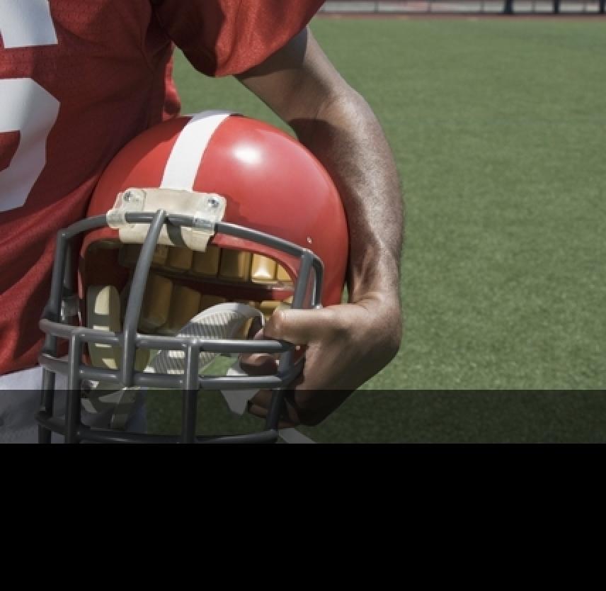 Football helmets don't protect against concussion — and we're not