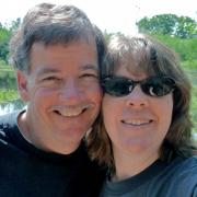 David Grant and his wife smiling into the camera